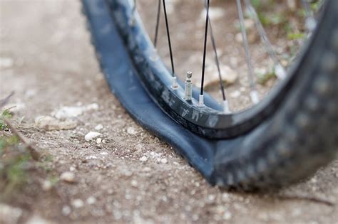 Why Does My Bike Tire Keep Going Flat: A Journey Through the Mysteries of Punctures and Beyond